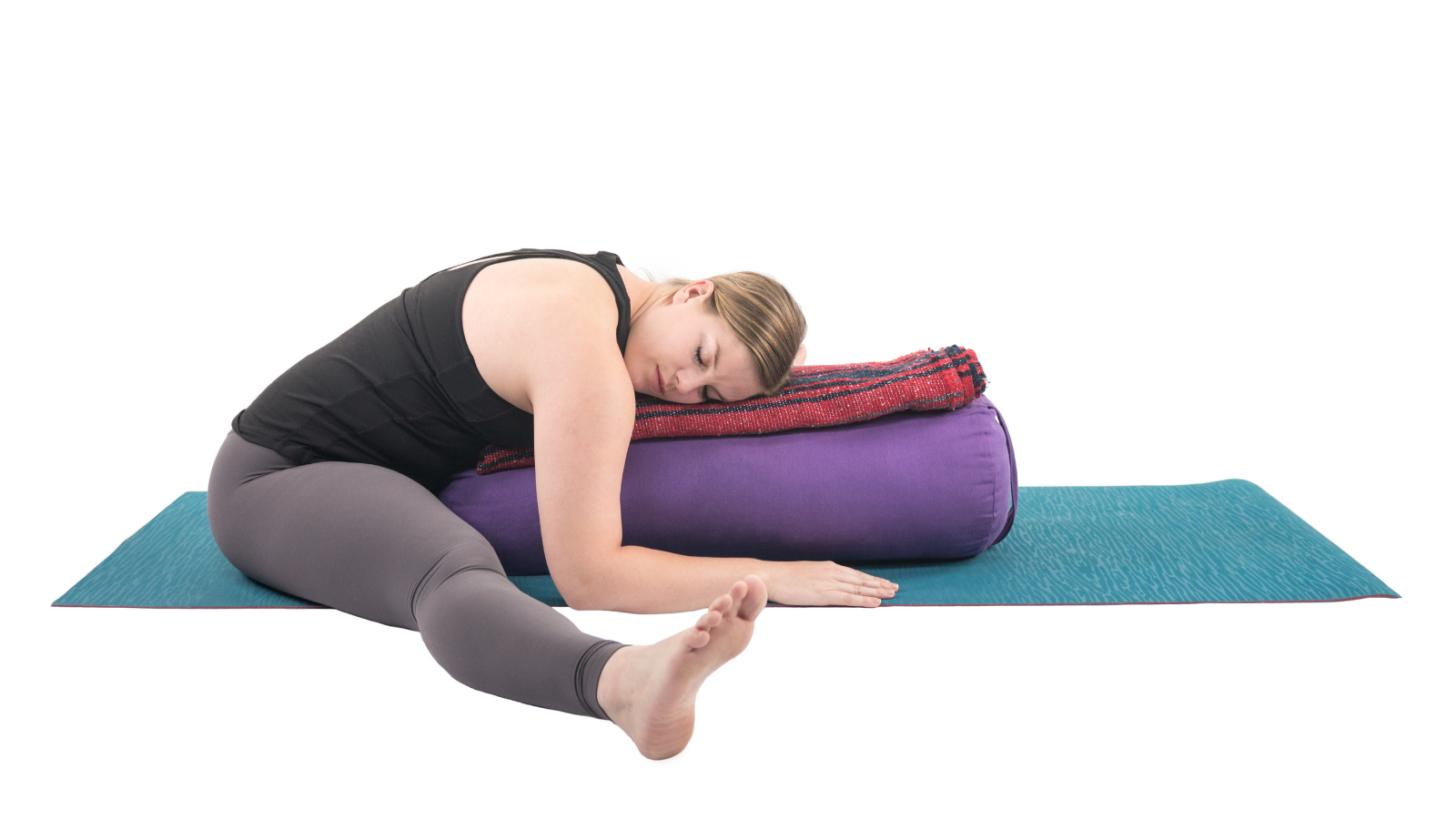 How to practice calming soothing forwards folds that prepare you for a good night's sleep beat insomnia with a Restorative Wide Legged Forward Fold with support of a bolster