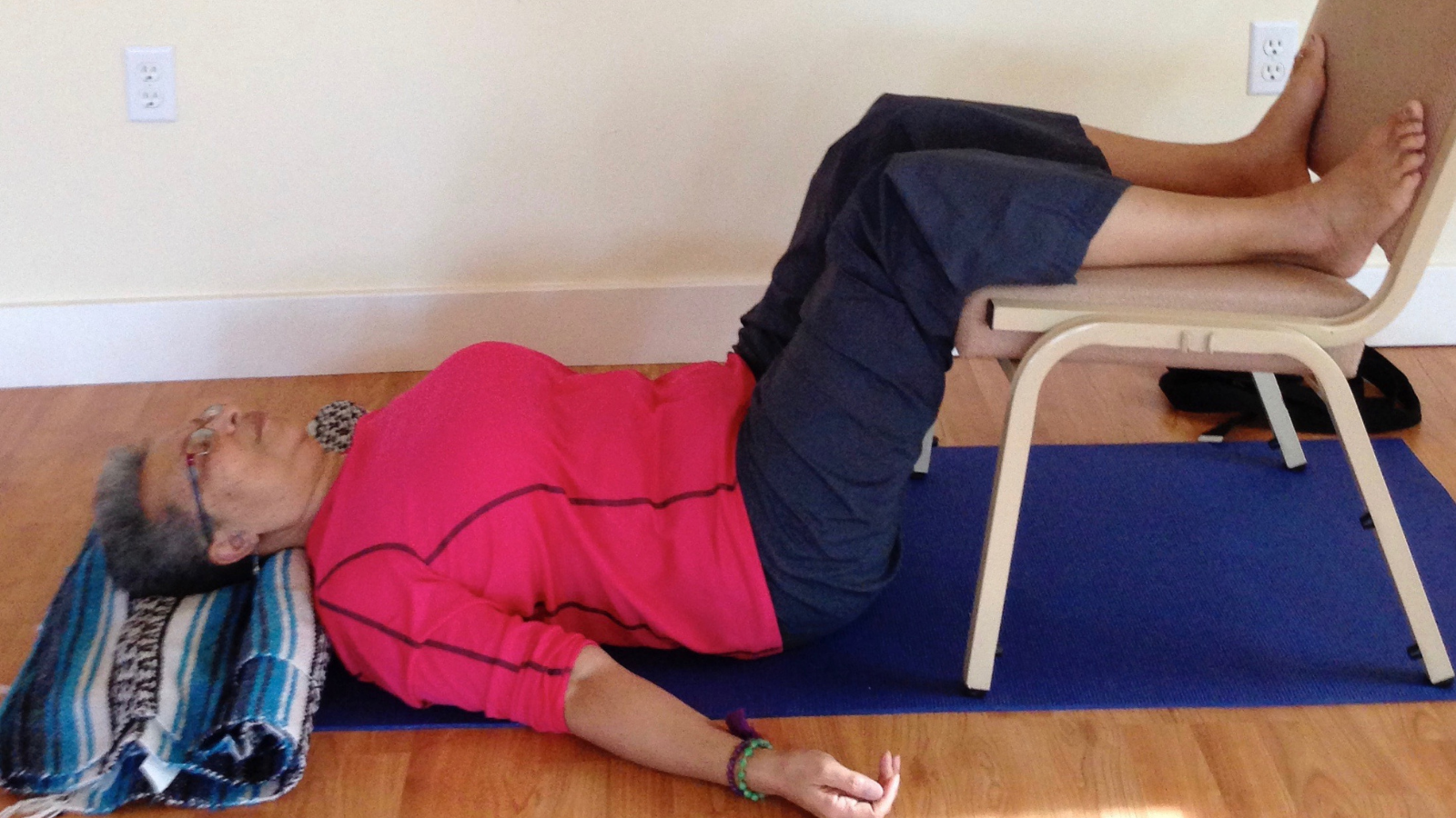 How to practice Legs in the Chair Pose- a mild inversion and stabilizing pose Legs on the Chair Pose -- a variation on Legs up the Wall Pose which is a calming and stabilizing yoga pose to overcome anxiety brought by perfectionism