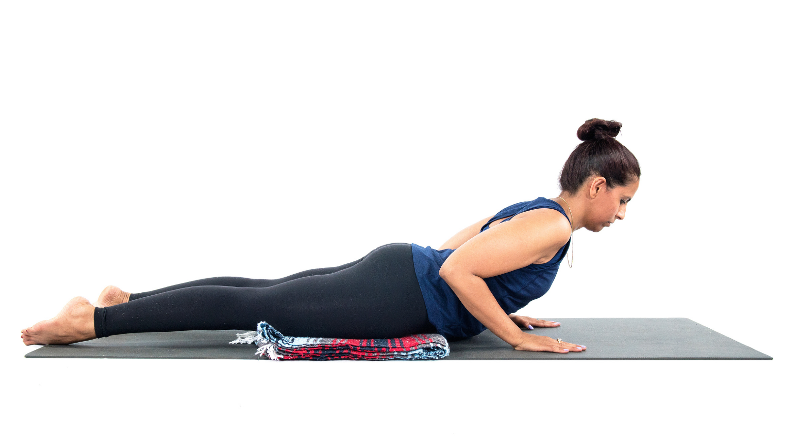 How to practice Cobra Pose with the support of a blanket for the hips. Cobra Pose also known as Bhujangasana.
