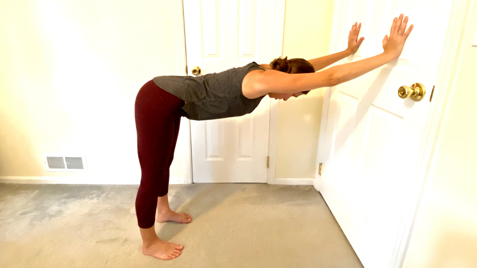 How to get the support of the wall practicing a Downward Facing Dog variation which is gentler for people suffering from arthritis Gentle way to practice Downward Facing Dog Pose or Adho Mukha Svanasana at the wall