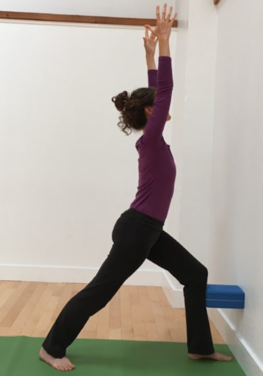 How to move into a backbend with Warrior 1 at the wall and adding arms overhead. Warrior 1 or Virabhadrasana 1 with backbend at the wall.